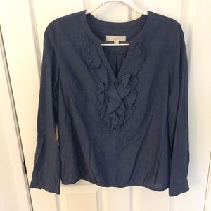 blue ruffled blouse